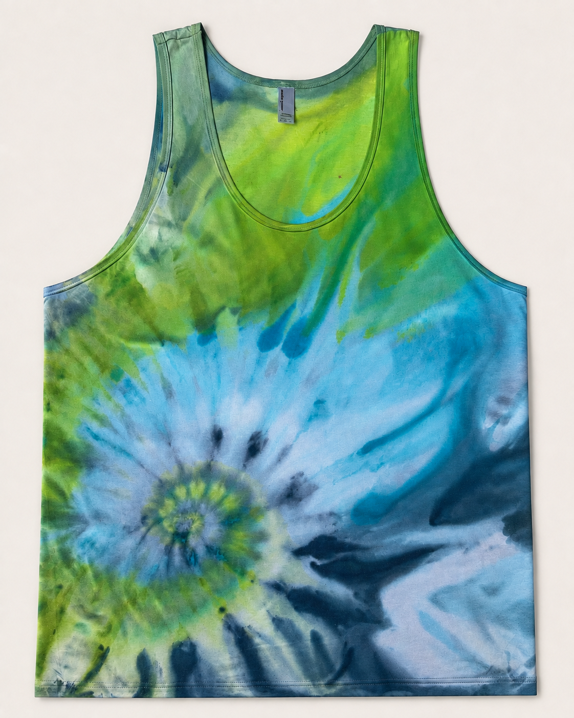 Front of Lagoon Bloom singlet with a blue-white offset spiral and green upper section