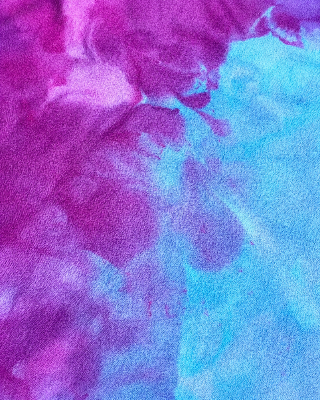 Close-up of pink and blue tie-dye fabric